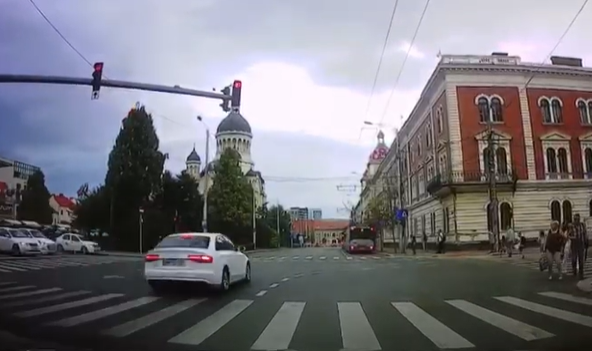 ignorând culoarea roșie a semaforului